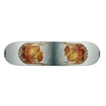 Glass tumbler filled with scotch and ice cubes skateboard deck