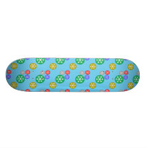 Gold silver red green snowflakes on blue skateboard decks