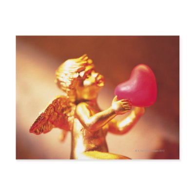 Golden angel holding pink heart, side view, soft post cards by prophoto