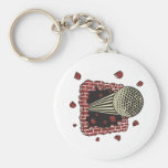 golf ball breaking through brick wall key chains