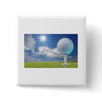 golf ball on a tee with grass pin