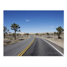 good looking street in the middle of the dessert post cards