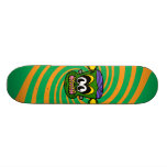 Green Frankenstein monkey on orange swirl Skate Deck