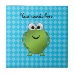 Green frog on blue argyle tiles