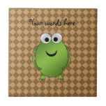 Green frog on brown argyle tiles