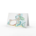 Green-haired mermaid wearing large selection of cards