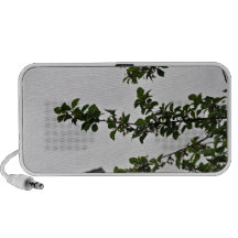 Green leafy branch against the cloudy sky iPod speakers