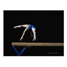 Gymnast (9-10) flipping on balance beam, side post card