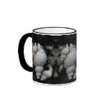 Hairy Trident Seashells on Black Background Coffee Mug