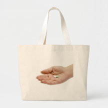 Hand holding pills tote bag