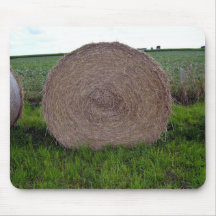 Hay bale rolls in a green field mouse pads