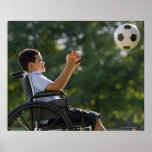 Hispanic boy, 8, in wheelchair with soccer ball print