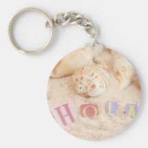 Hola, hello in Spanish on a sandy beach Keychains