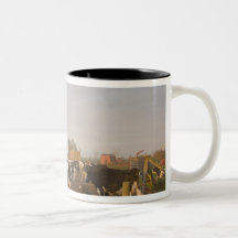 Holstein dairy cows outside a barn at sunrise coffee mugs