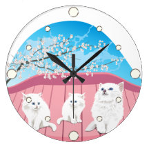 Horloge murale de trois chatons