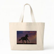 Horse silhouette galloping free at sunset canvas bags