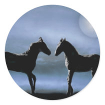 Horses making friends by moonlight round sticker