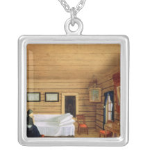 Interior with a seated woman personalized necklace