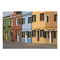 Italy, Burano. Colourful row of homes and empty