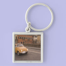 Italy, Florence. Fiat 800 Rally crosses Arno keychains