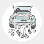 Just married car dragging cans round stickers