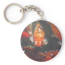 Koi Fish glide among the still green  waters Keychains