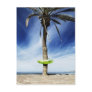 Large palm tree on a sandy beach with inflatable post cards