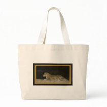 Leopard lying on sand bank wildlife bags