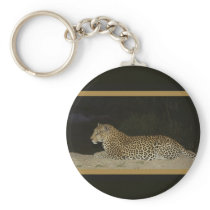 Leopard lying on sand bank wildlife keychains