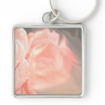Light pink rose reflection in silver keychains