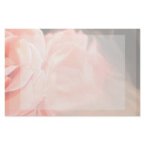 Light pink rose reflection in silver stationery paper