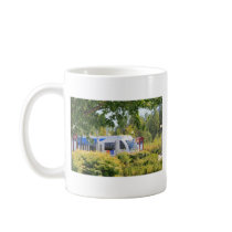 Light rail train seen through landscape. mugs