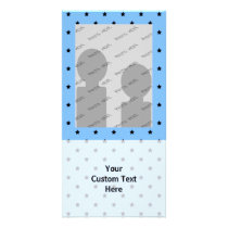 Little black stars on a light blue background. photo greeting card