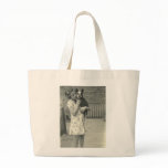 Little girl holding her dog bag