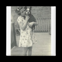 Little girl holding her dog magnets