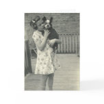 Little girl holding her dog greeting card