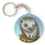 Little hedgehog on a big pile of leaves key chain