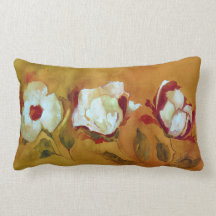 lumbar pillow with white flowers on amber backgrd