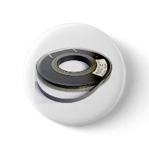 Magnetic tape reel button