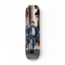 Man Crossing Street With Bicycle Skateboard Deck