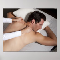 Man having a back massage from woman posters