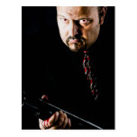 man holding gun post card