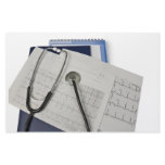 medical stethoscope on cardiogram EKG readings stationery