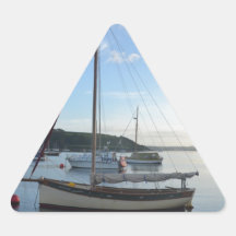 Moored sailing cutter at dawn. triangle sticker