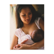 Mother breast feeding newborn postcards