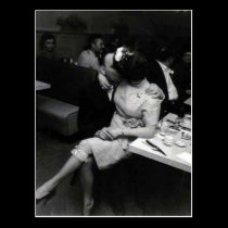 newlyweds kissing at a resturaunt postcards