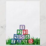 Number blocks stacked on grass flyers