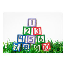Number blocks stacked on grass invite