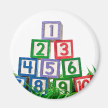 Number blocks stacked on grass magnet