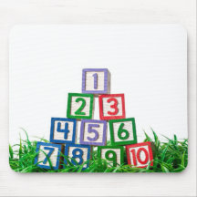 Number blocks stacked on grass mousepads